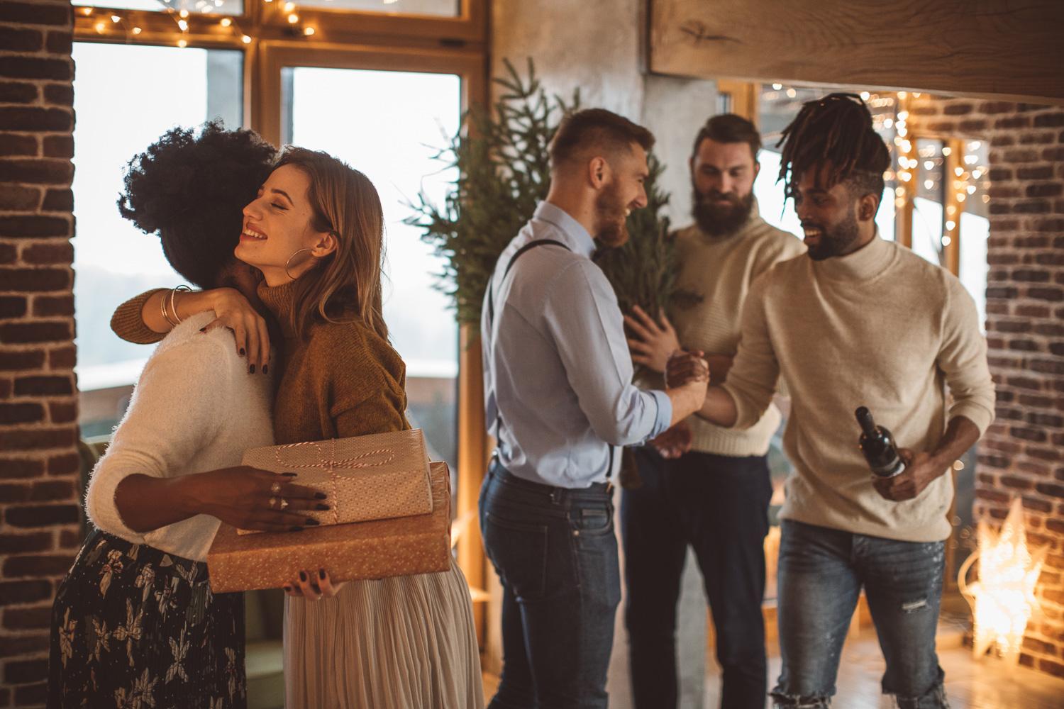 A joyful group celebrating in a cozy room.