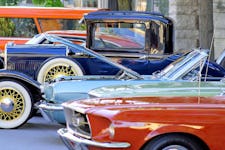 Colorful classic cars parked along a street