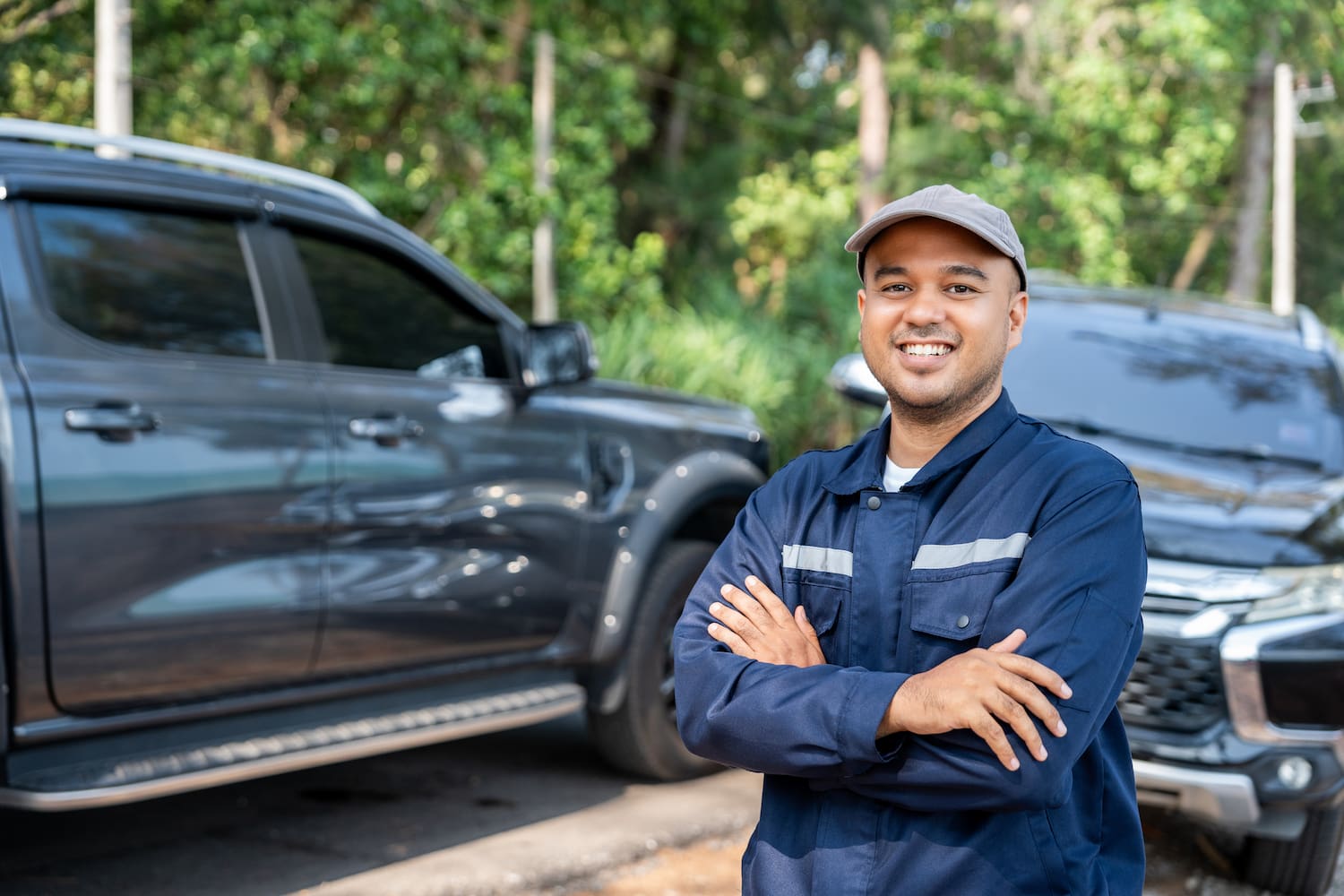 A young person posing for a picture in front of a car accident site