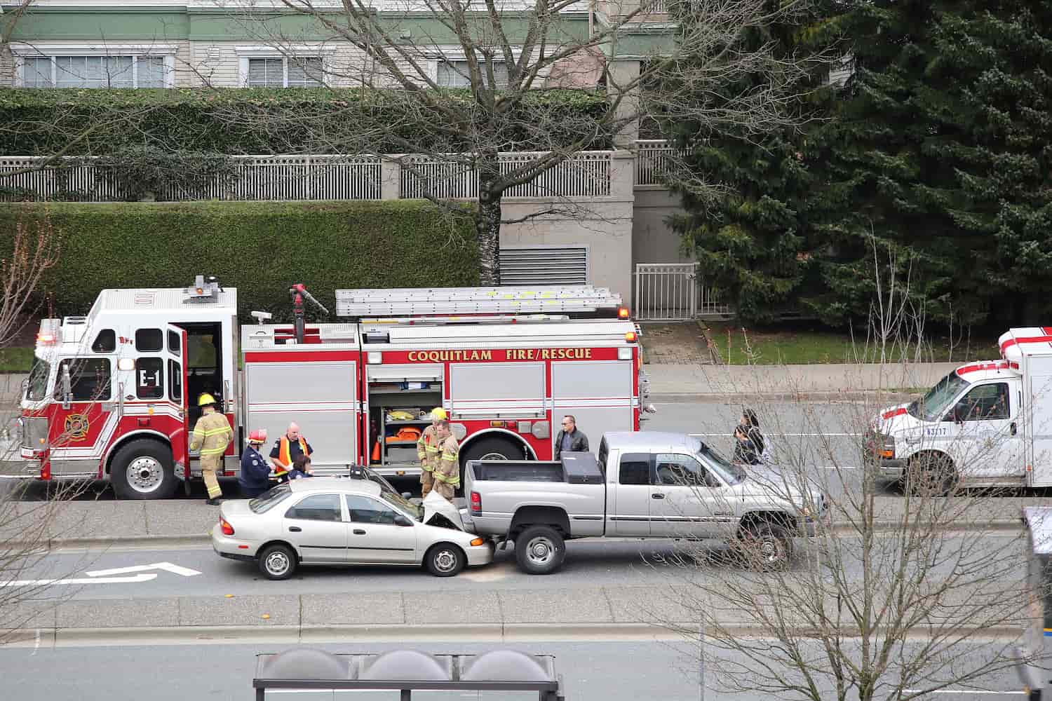 Two cars involved in an accident with a fire truck present at the scene.