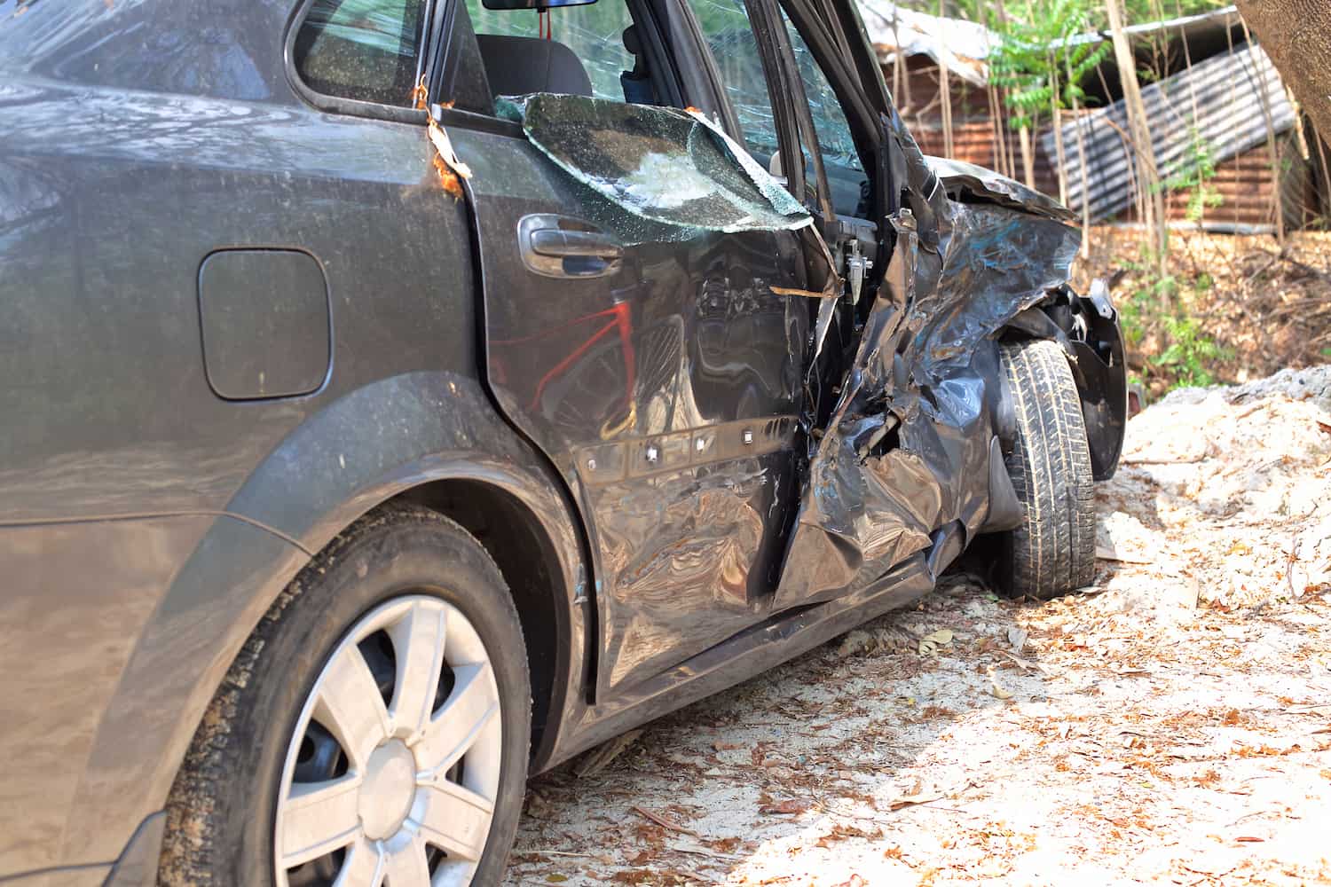 A wrecked car lays in wait after a car accident..