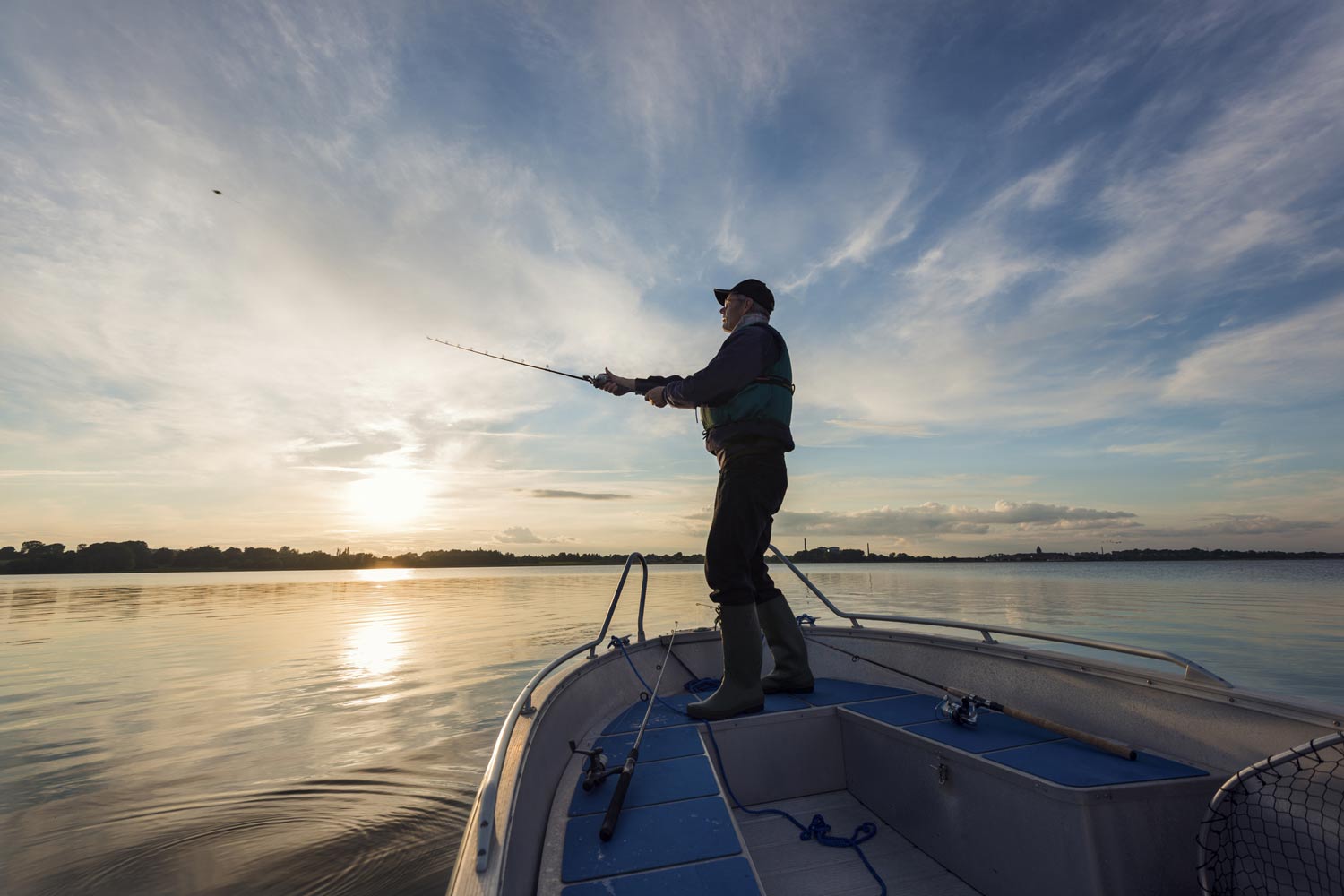 Fisherman casting out his line.