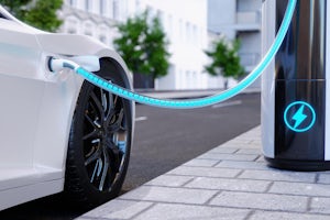 Charging station for electric vehicles on city streets with blue energy battery charging an electric vehicle