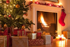 Christmas tree and stocking near fireplace
