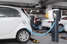 Close-up View Of Charging Electric Car In Parking Garage