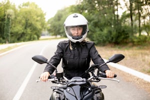Female motorcycle driver on the road