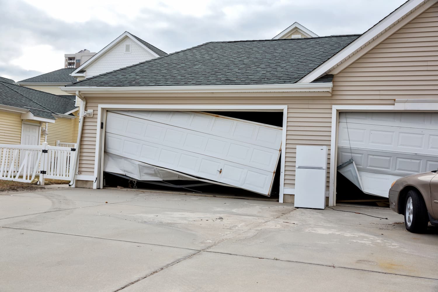 Home with a damaged garage.