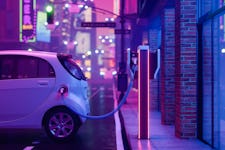 Metaverse Style City With Charging Electric Car On Street And Blurred Background With Neon Lighting