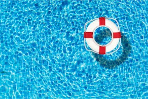 Life preserver floating in a clear pool water