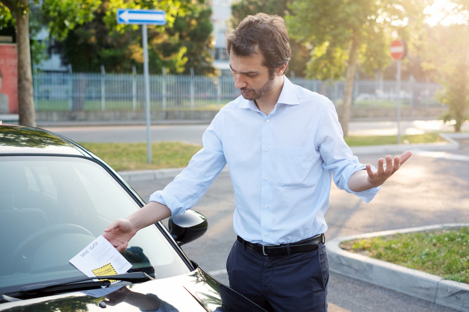 A man appeared visibly upset as he received a parking ticket.