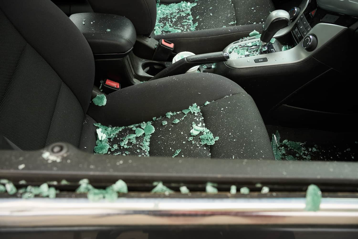 Close-up of the shattered glass of a passenger window