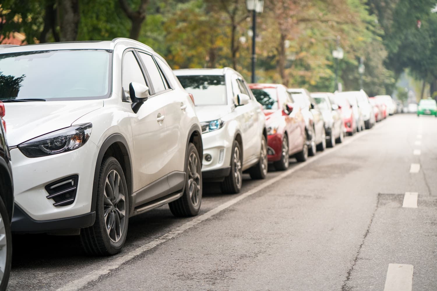 Cars parked on the urban street side.