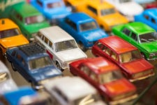 Heap of toy cars of different brands and colors