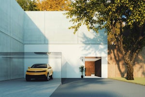 Generic yellow car parked in a garage of a luxury home
