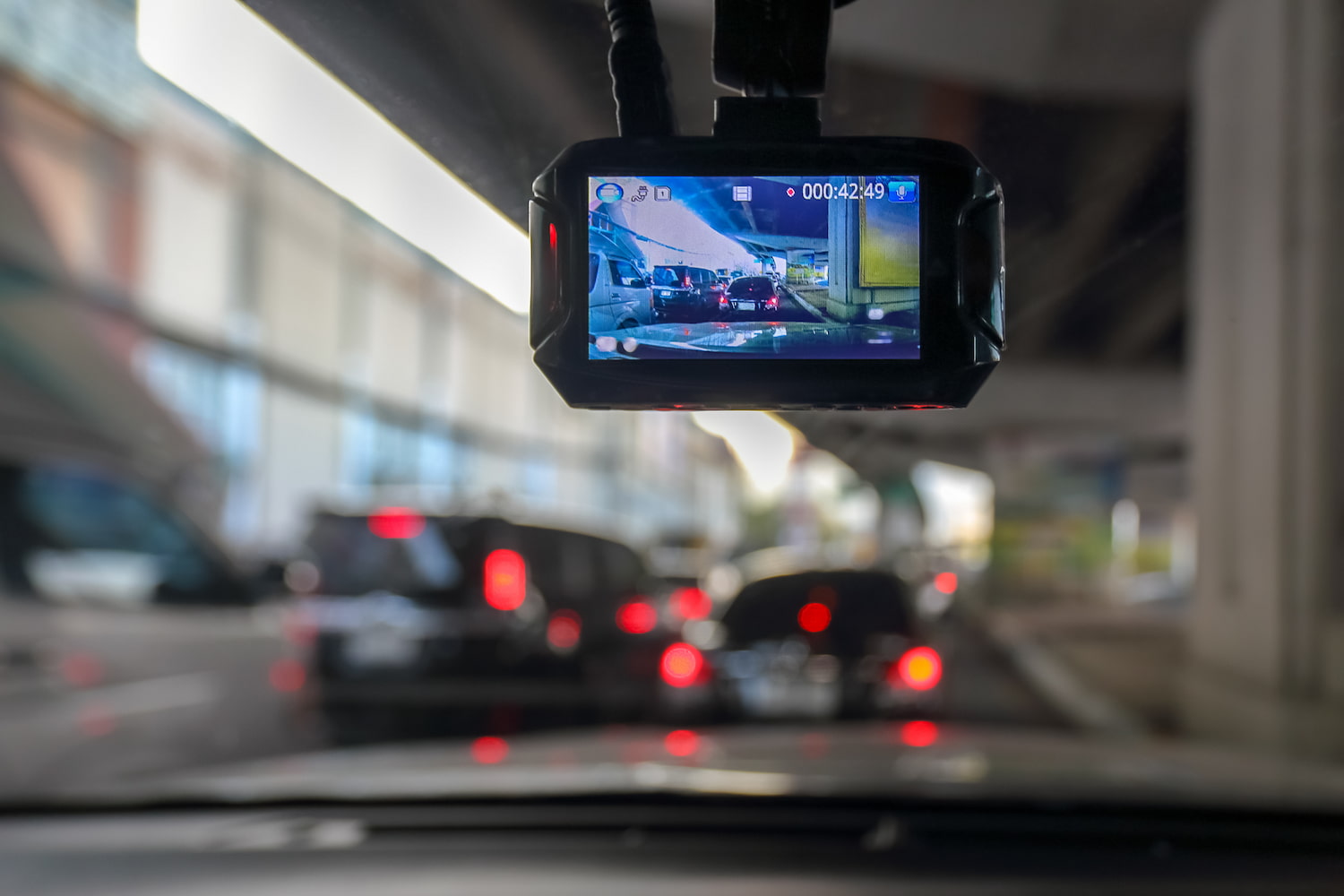 Dashboard camera installed in a vehicle during travel.