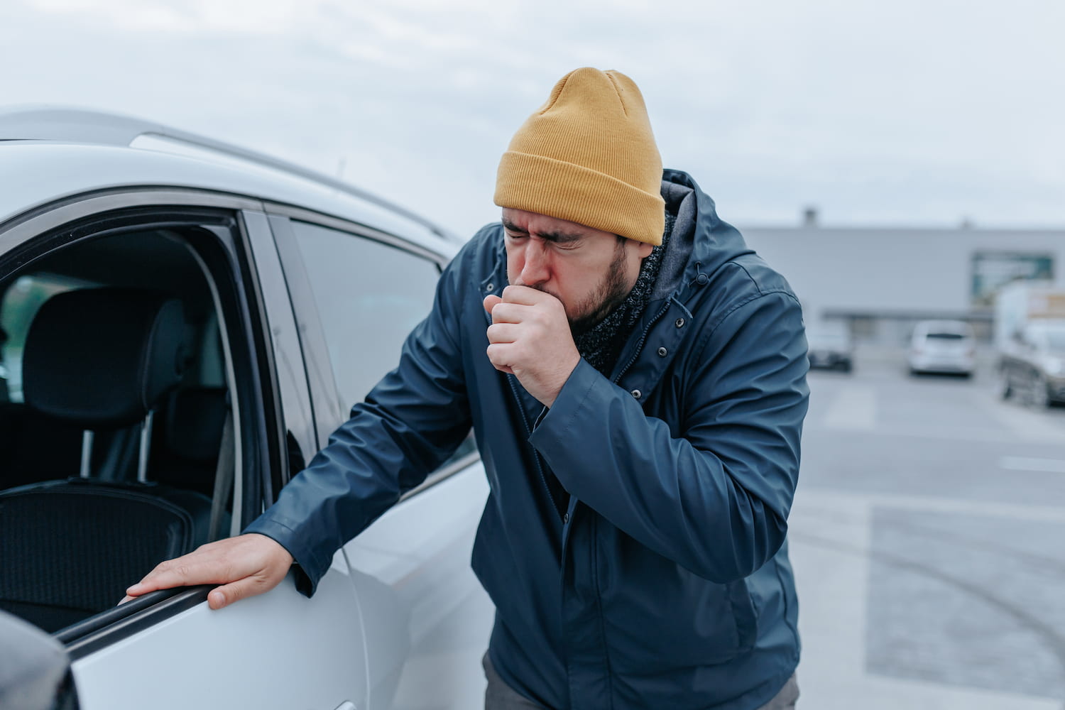 A person in a hat, dealing with illness